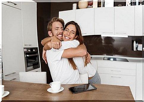 couple hugging in the kitchen 