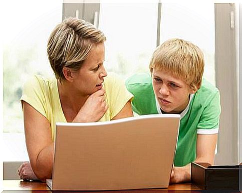 Mistakes children of school age.  Mom helps her son with his homework.