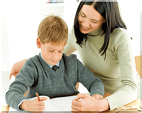 Child does homework with mom. 