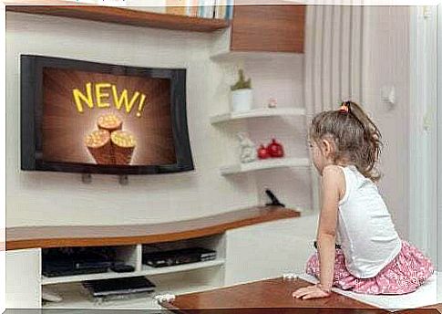 Little girl watching advertising