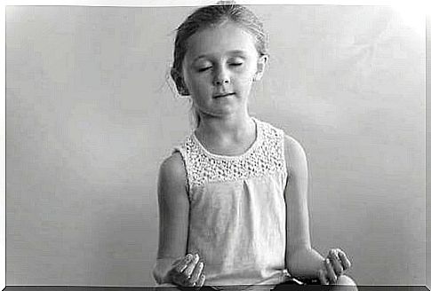 little girl practicing yoga