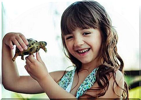Little girl with turtle.