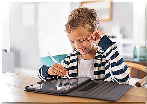 Child studying using a tablet.  Create a study area.