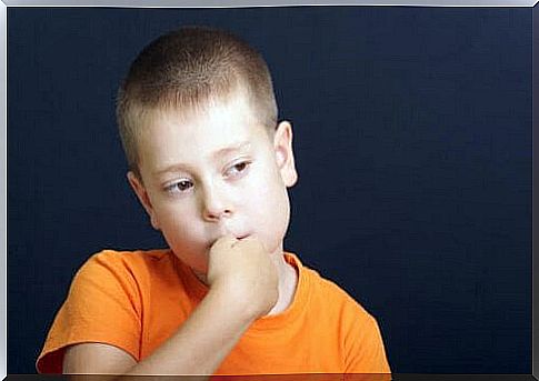 Child with hands in mouth how to prevent children from biting their nails