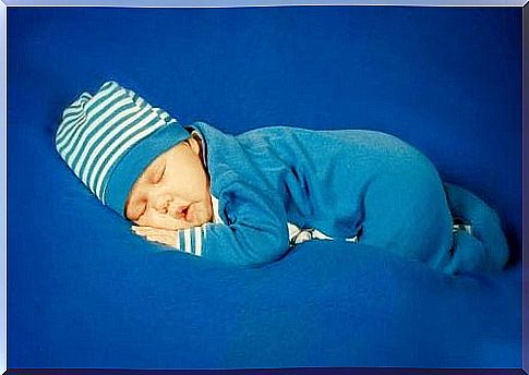 Newborn baby sleeping with onesie