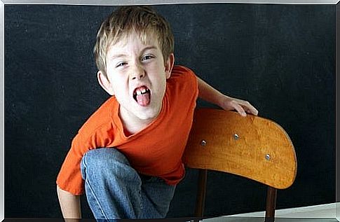 A child sticks his tongue out.