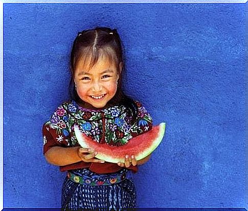 Little girl eating watermelon