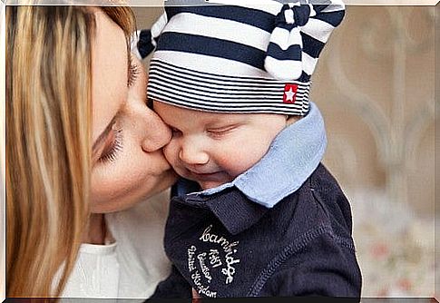 Big fears of a mother: woman kisses her little son