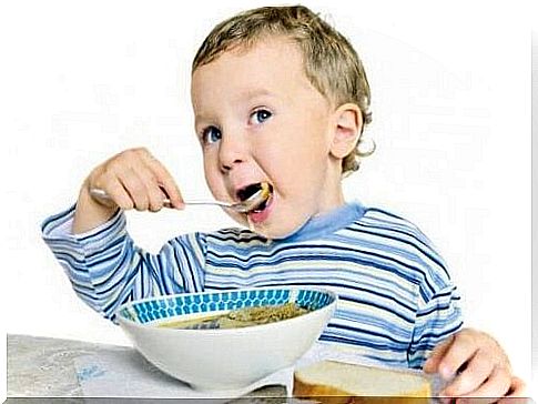Child eats soup