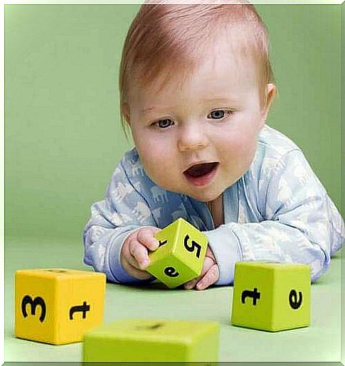 Child plays with dice